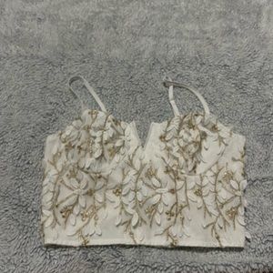 Small cropped corset looking top, gold and white floral embroidery